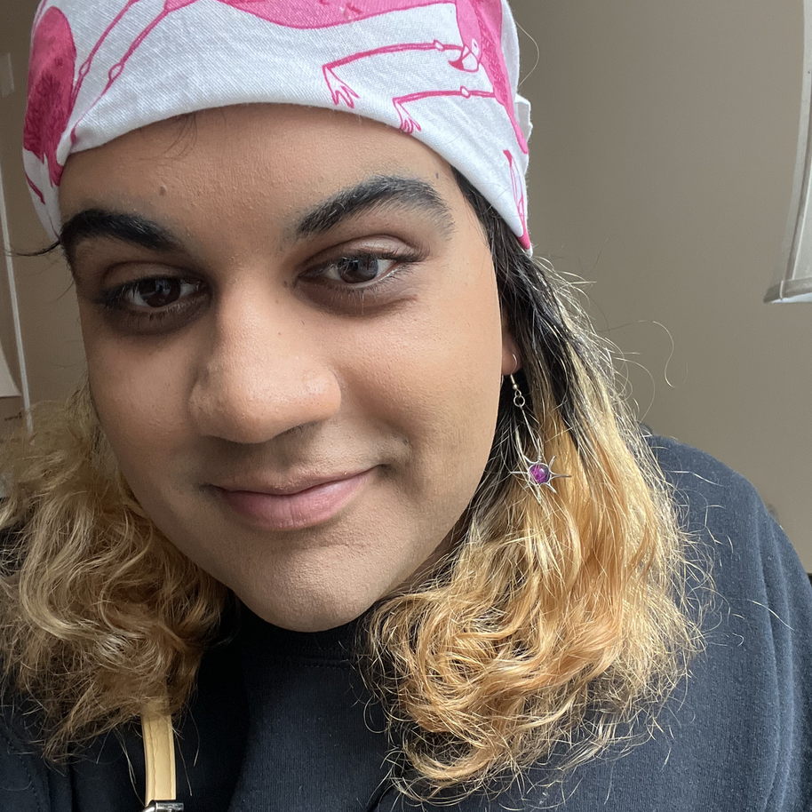 me wearing a bandana with flamingos on it